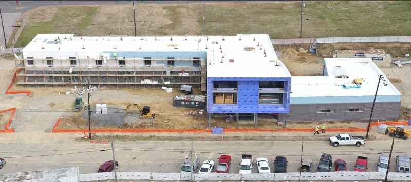 Image of construction site with partially completed building