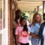 Hospitality Hub team welcoming a family into a new home